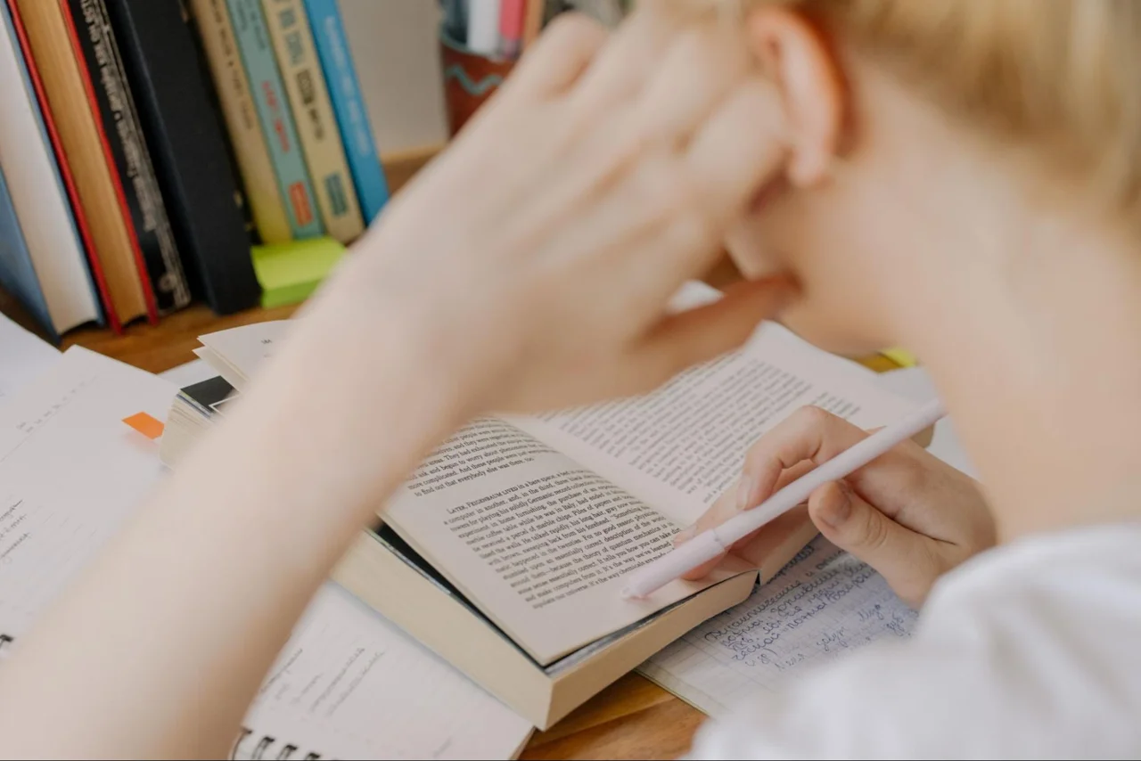 A person reading an open book