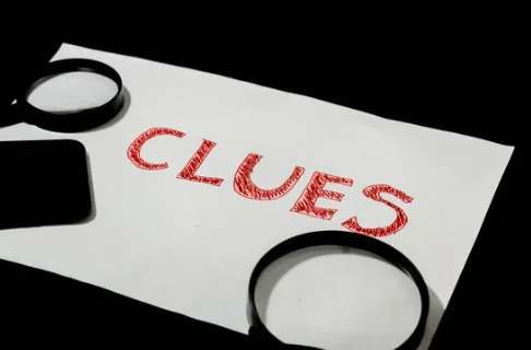 Magnifying glasses beside the word clues